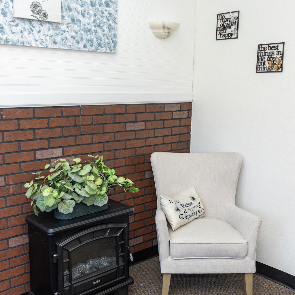 Office — white chair with brick wall